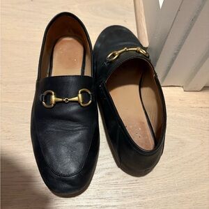 Black Leather Loafers with Gold Detailing